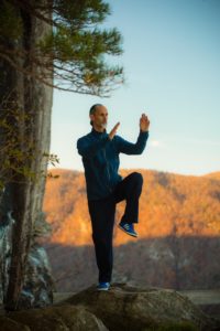 Camilo Sanchez demonstrating tai chi in the mountains.